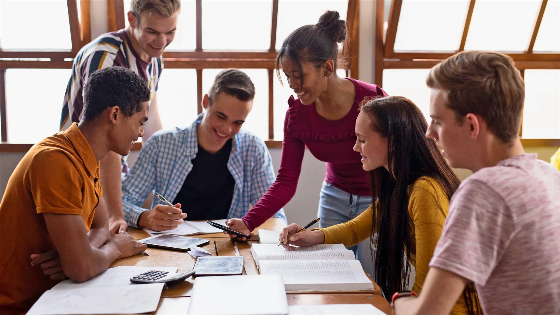 Students learning together around a table